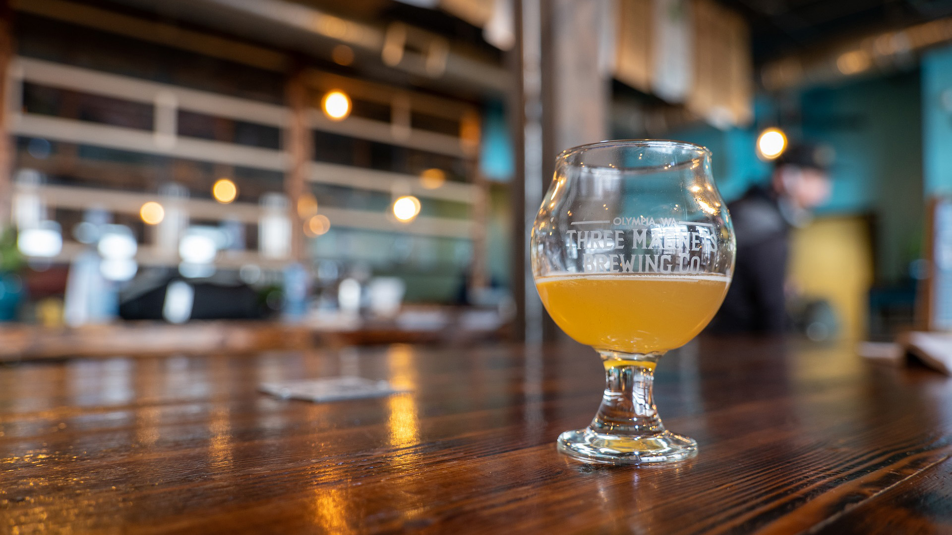 A tasting glass of beer in the Three Magnets Brewing Co. taproom